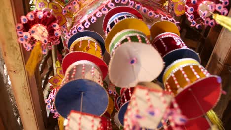 colorful handmade decoration hanging from the ceiling -tam coc, vietnam -close up