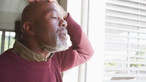 Video-of-lonely-thoughtful-senior-american-african-men-in-living-room