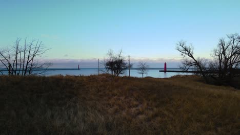 lighthouses at the mouth of the bay as seen from muskegon's horseshoe