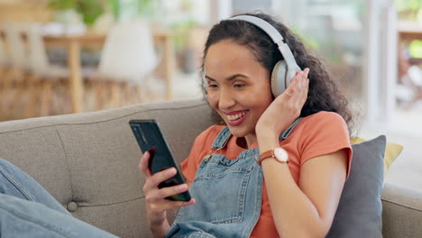 headphones, phone and woman on sofa listening