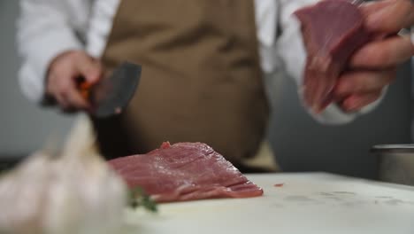 chef preparing raw meat