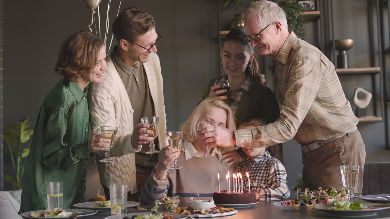 Senior Woman Celebrating Her Birthday With Her Family At Home
