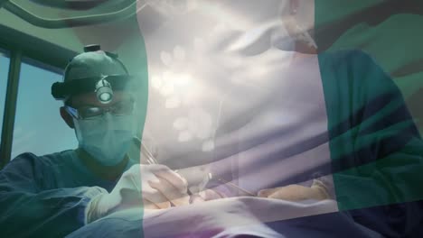 animation of flag of nigeria waving over surgeons in operating theatre