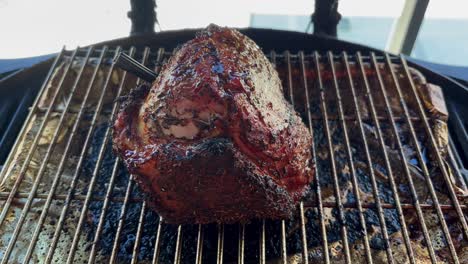 uicy roast beef on grill with temperature probe attached – close-up cooking footage showing meat grilling process, heat monitoring, and delicious bbq preparation