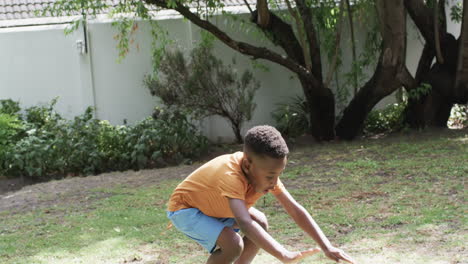 african american boy plays outdoors