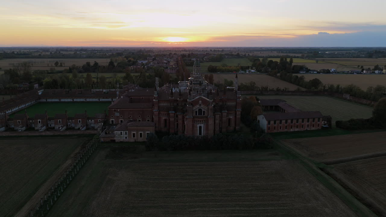 Certosa di Pavia aerial shot at sunset Gra-Car (Gratiarum Carthusia, Monastery of Santa Maria delle Grazie - Sec. XIV),Pavia, Italy