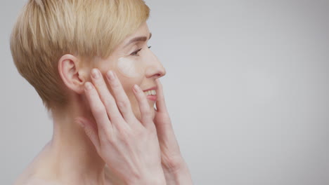 woman applying eye patches