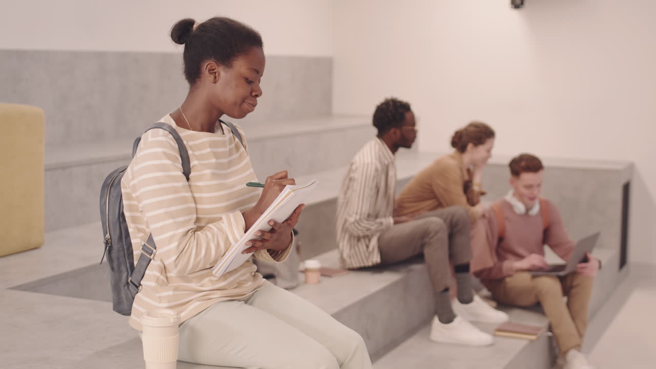 African-American Female Student with Notes in Uni