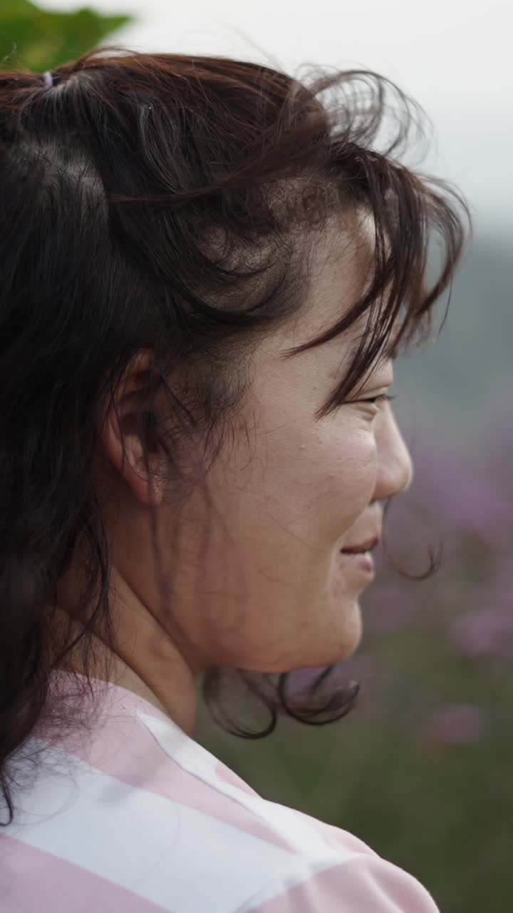 A woman's profile portrait outdoors