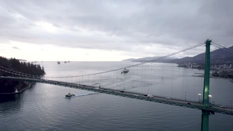 car traffic over lions gate bridge crossing burrard inlet, vancouver in canada