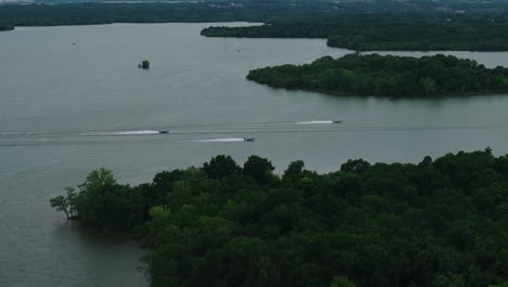 motorboats speeding across percy priest lake in nashville, tennessee, usa