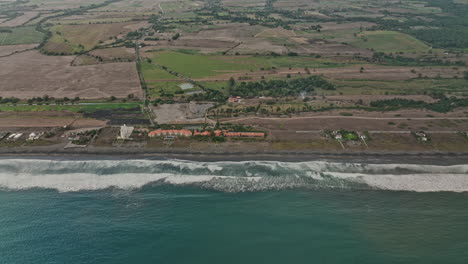 palo grande panama aerial v8 cinematic birds eye view overlooking at pacific ocean tilt up reveals coastal beach and rural farmland with stormy clouds in the sky - shot with mavic 3 cine - april 2022