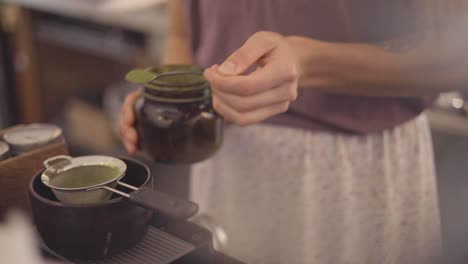 stirring hot coffee in coffee shop