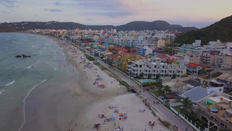 Aerial-establishing-shot-revealing-Bombas-y-Bombinhas-just-after-sunset-in-Brazil