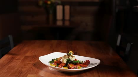 Plating-Grilled-Halibut-Fish-With-Cooked-Vegetables-And-Sauce-On-The-Table