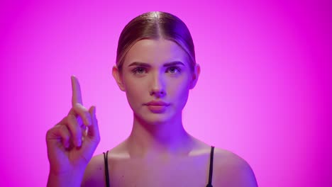 woman waves with finger to say no, concept refusing, studio shot