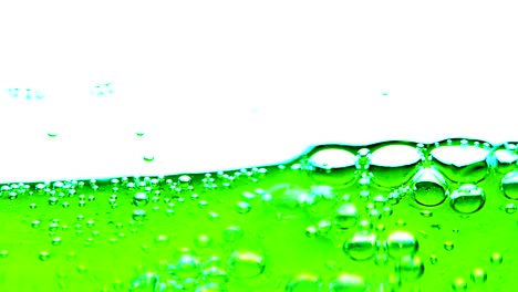 water oil bubbles  behind glass background