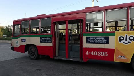 bus driving towards camera and coming to a halt