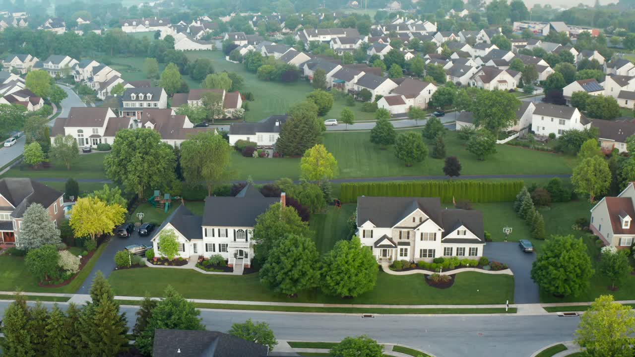 Suburban America neighborhood community during summer misty morning