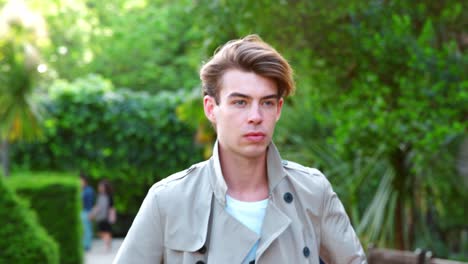 Portrait-Of-Stylish-Man-Wearing-Jacket-Walking-In-Park