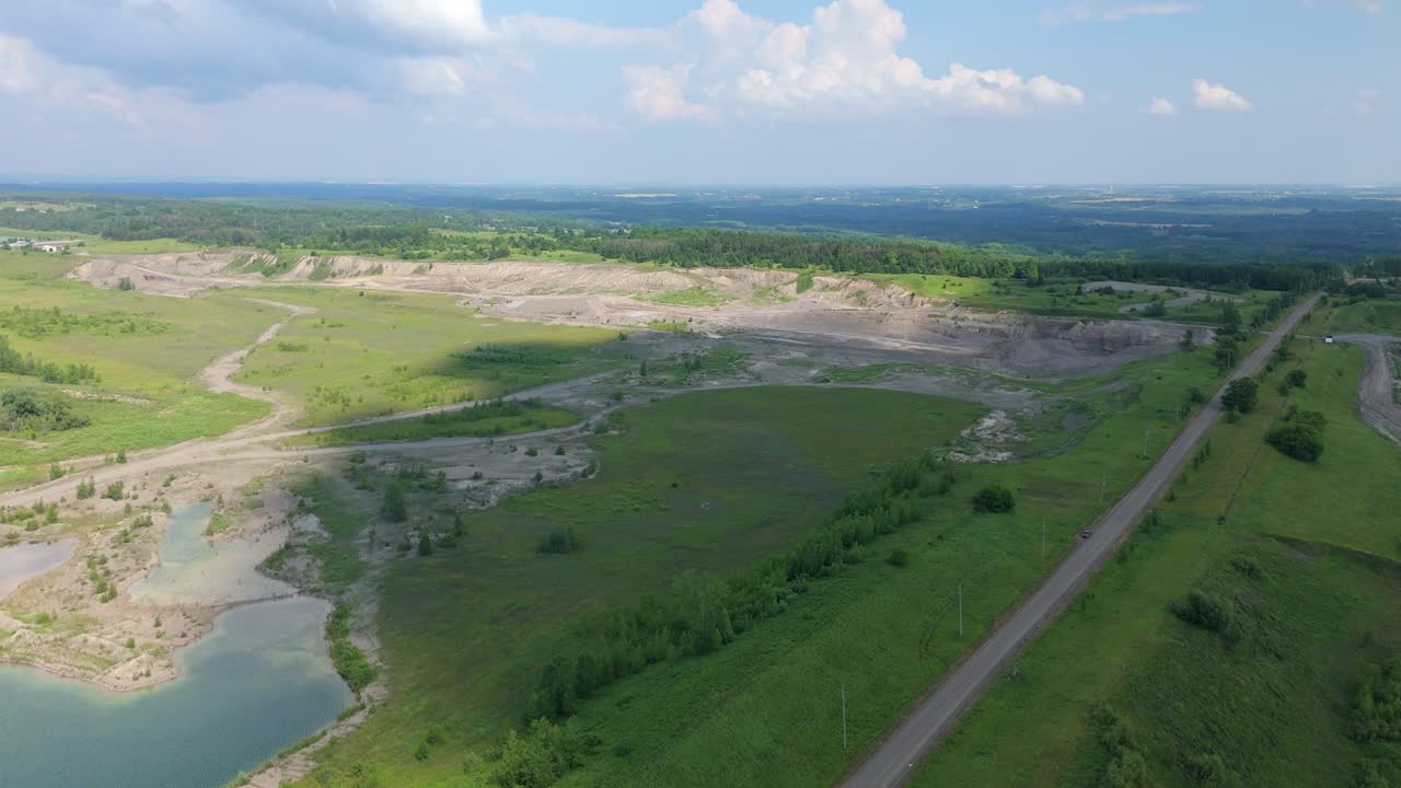Aerial view of gravel pit in Caledon, Canada, surrounded by fields