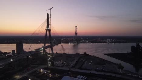 Silhouette-of-Gordie-Howe-International-Bridge-under-construction,-aerial-view