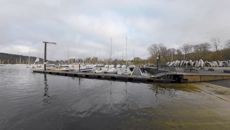 Boats,-sailing-ships,-moored-on-the-harbor-of-Bowness-on-Windermere