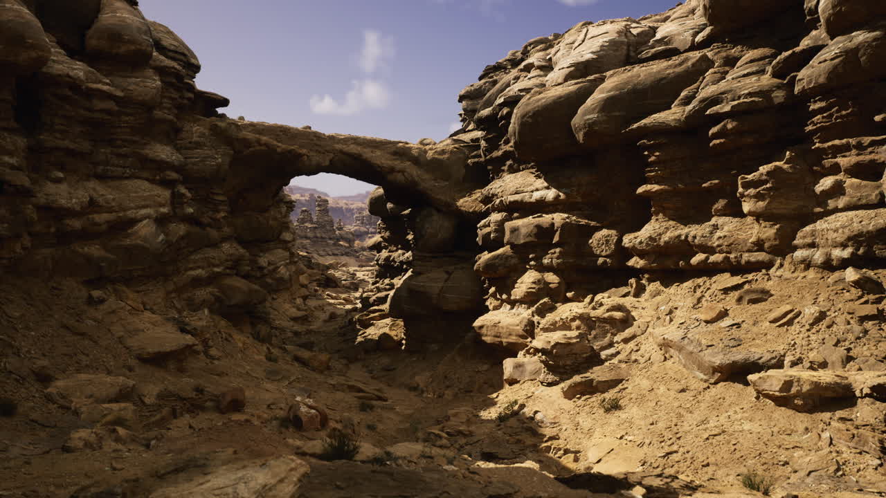 Unique rock formation in a dry desert landscape under a clear sky