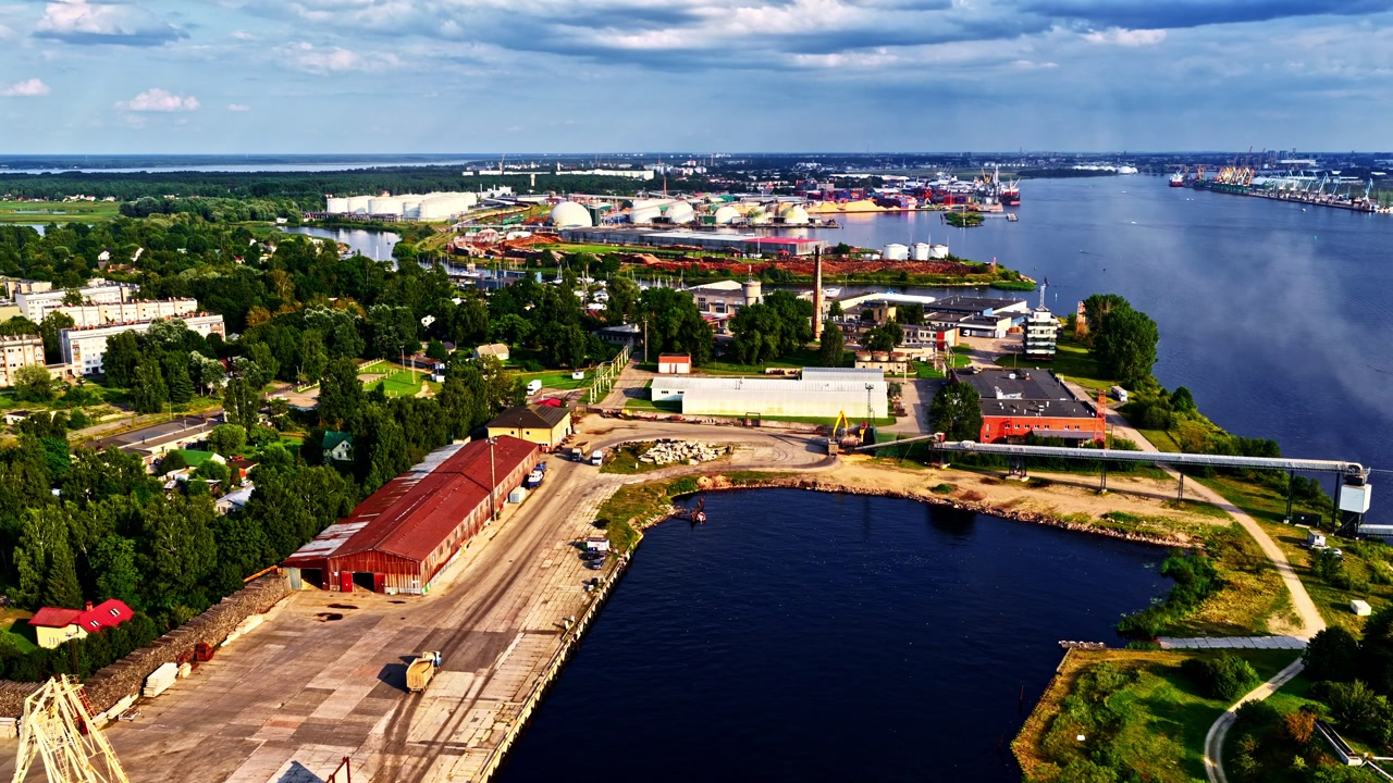 Scenic aerial view of vibrant riverside industrial port city landscape