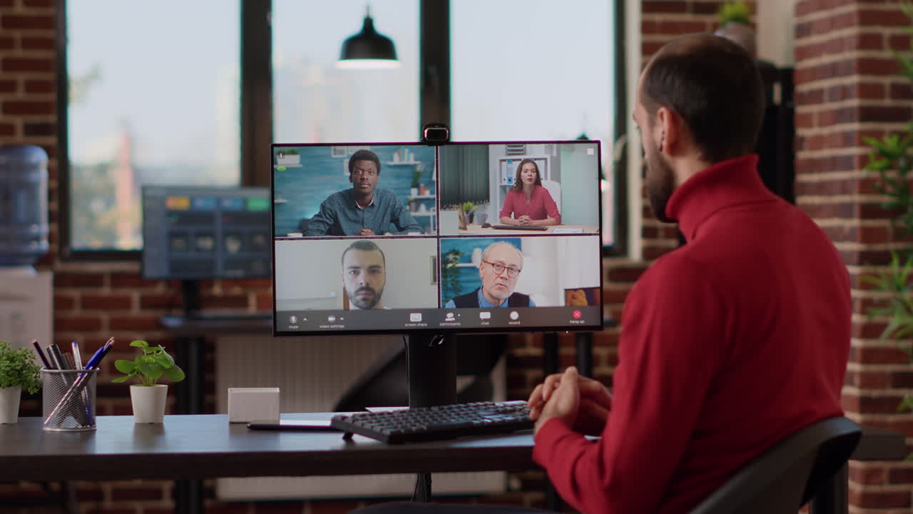 Businessman talking to colleagues on remote videoconference