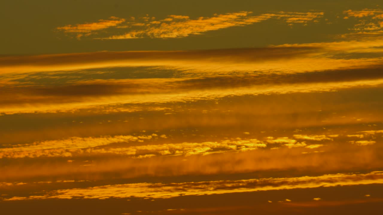 Establishing Shot of Impressive Sunset Golden Hour Natural Layered Clouds in France, Europe 4K