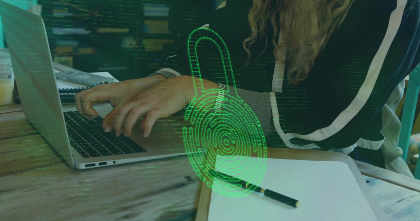 IT professional typing on laptop, fingerprint expanding into padlock, pausing scan, resuming typing