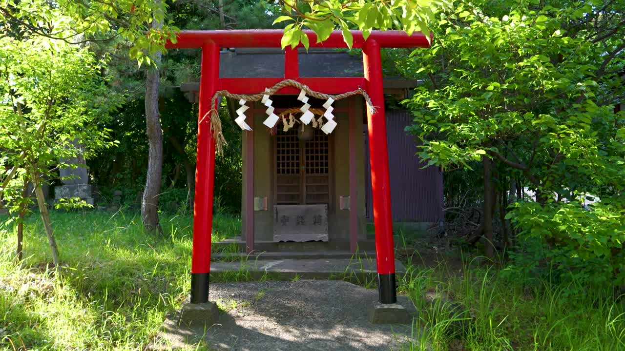 Serene Japanese Shrine with Red Torii Gate