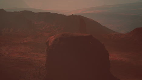 a desolate martian landscape with towering rock formations and a vast canyon in the distance.