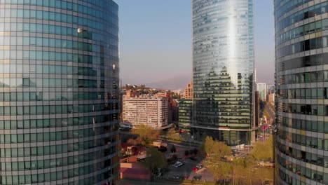 flying backwards between two buildings revealing the skyline, santiago, chile-4k