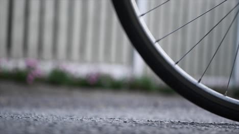 Close-up-shot-of-bicycle-wheels-rolling-by-in-slow-motion