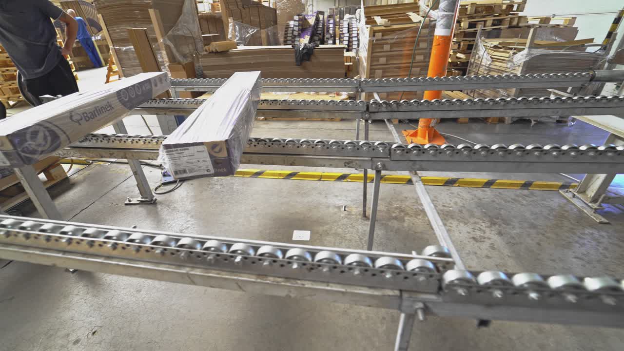 Floorboard production in the industrial factory. Manufacturing of a parquet board. Modern technologies.