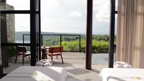 slow motion of a luxury spa massage room overlooking nature and a valley in nusa penida bali indonesia