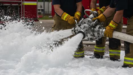 firefighters deploying foam suppression equipment: a critical response to fire emergencies with advanced foam technology in action