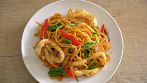 stir-fried spaghetti with salted egg and squid - fusion food style