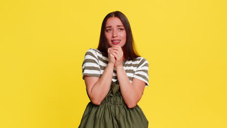 woman singing into imaginary microphone with closed eyes expressing emotions feeling like music star