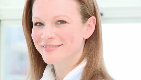 close up of beautiful young businesswoman smiling