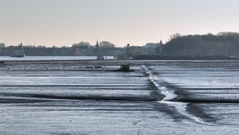 low fast orbit of boardwalk over the sophiapolder tidal flats near rotterdam netherlands