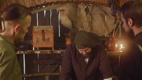 medieval men playing a board game