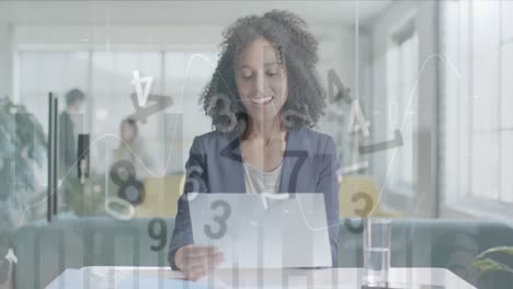 Animation-of-processing-data-over-biracial-casual-businesswoman-with-laptop-on-video-call-in-office