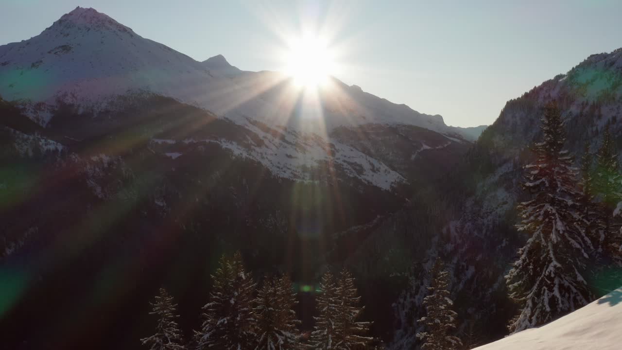 Scenic view of an open area on ridge in the mountains during winter. Aerial shot