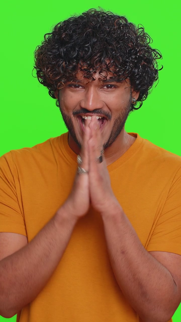 Indian man conspiring scheming thinking over tricky plan pondering revenge or evil joke prank