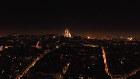 basilica of the sacred heart of paris by night aerial view rochechouart district