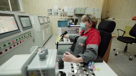 woman operator in industrial control room