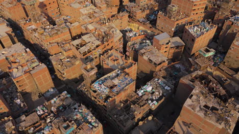 drone over cairo garbage district with houses and trucks